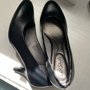 Women’s black slip on small heels.